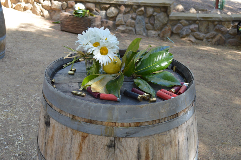 Wine Barrel Bar Table wit Shotgun Shells and Flowers - Country Wedding